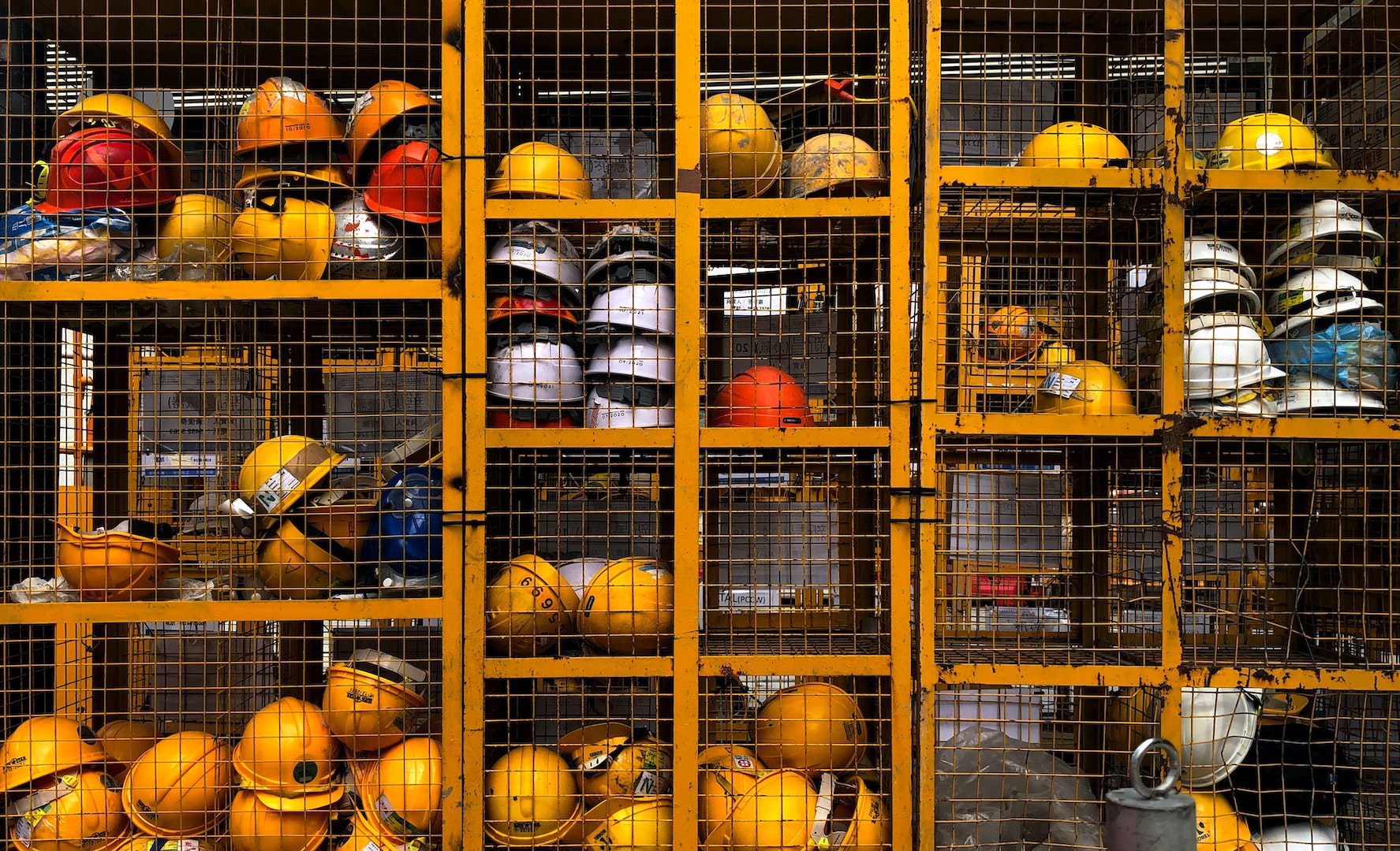 pop-zebra-wp81DxKUd1E-unsplash 02 Safety hats in a cupboard