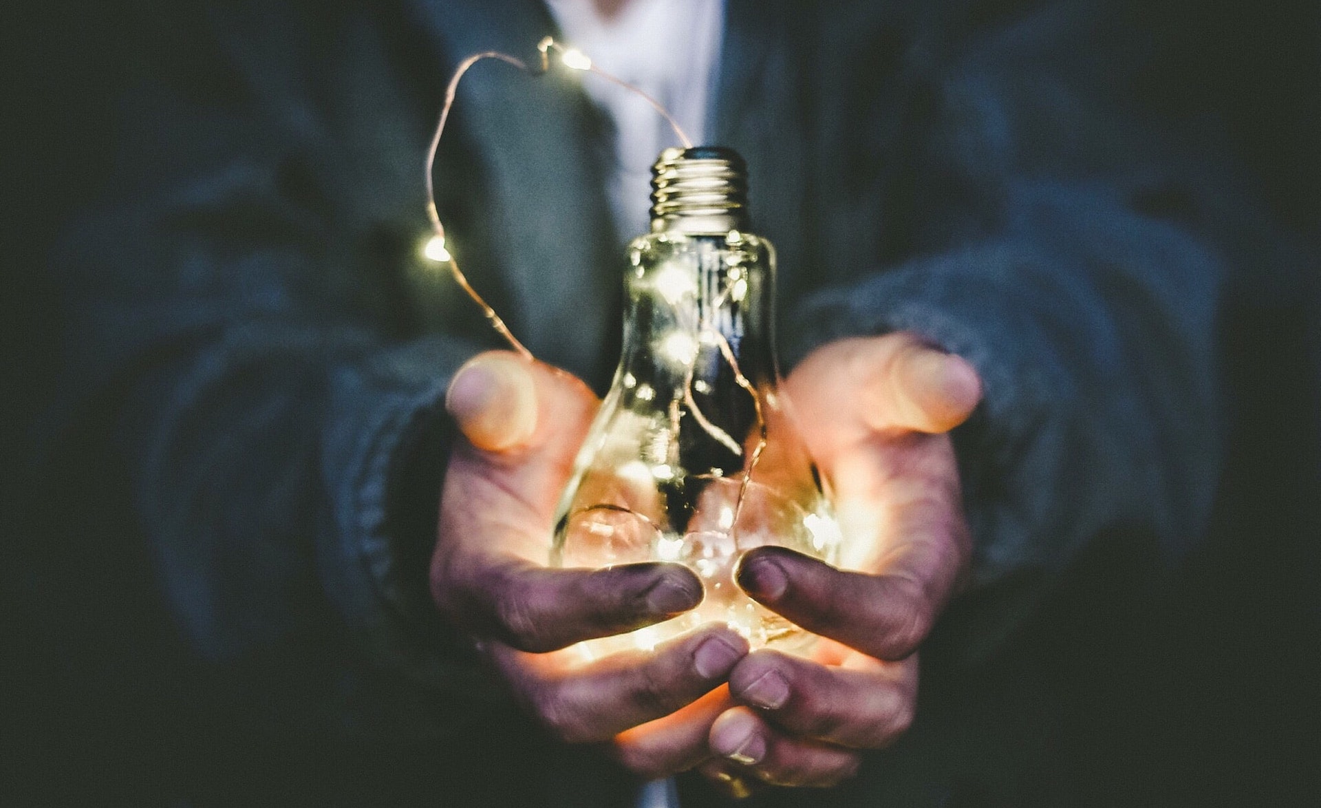 riccardo-annandale-7e2pe9wjL9M-unsplash Lightbulb in hands